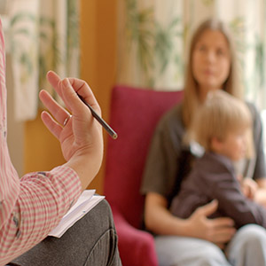 Co-parenting advisor meeting with mother and child for conflict resolution in Los Angeles.